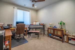 Guest Bedroom #3 space with carpet flooring and ceiling fan