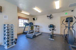 Exercise room featuring a textured ceiling