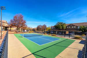 View of sport court featuring basketball hoop