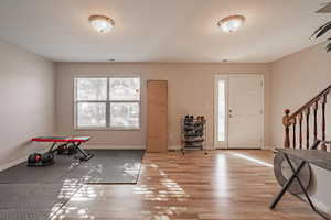 Entryway with light hardwood / wood-style floors