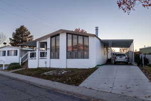 View of front of house featuring a carport