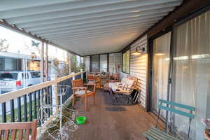 Balcony with covered porch and independent washer and dryer