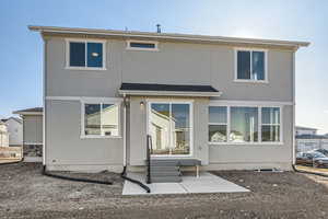 Rear view of house featuring a patio