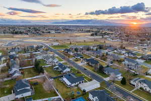 Aerial view at dusk featuring a mountain view