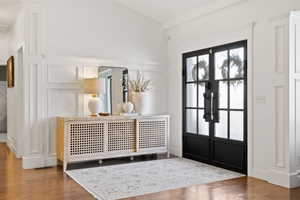 Foyer entrance featuring french doors and hardwood / wood-style flooring