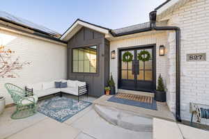 Doorway to property featuring solar panels and french doors