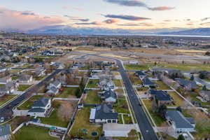 Aerial view at dusk featuring a mountain view