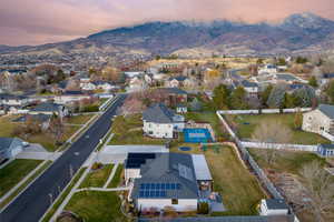 Aerial view at dusk featuring a mountain view