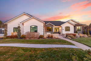 Ranch-style home featuring a yard