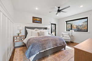 Bedroom featuring ceiling fan and dark hardwood / wood-style flooring