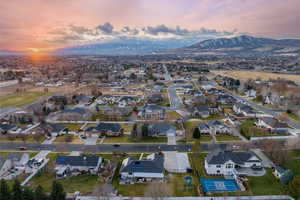 Aerial view at dusk featuring a mountain view