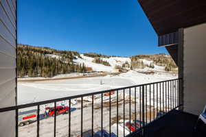 View of snow covered back of property