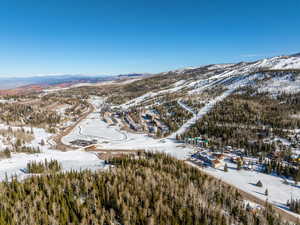 Snowy aerial view with a mountain view