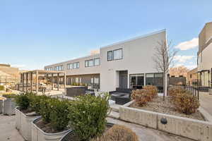 View of front of home with an outdoor hangout area and a patio