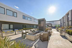 View of patio / terrace with an outdoor living space with a fire pit