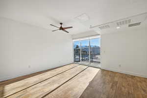 Unfurnished room with hardwood / wood-style floors