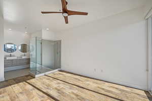 Unfurnished bedroom featuring hardwood / wood-style floors and ceiling fan