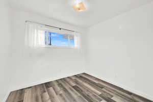 Spare room featuring hardwood / wood-style flooring