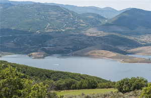 Property view of mountains with a water view