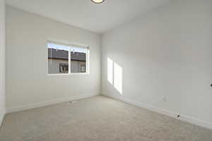 Unfurnished room with carpet