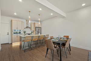 Dining space featuring dark hardwood / wood-style flooring and sink