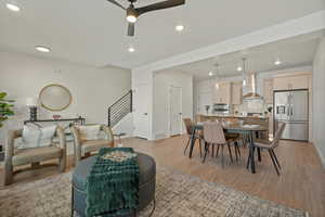 Dining space featuring ceiling fan and light hardwood / wood-style floors