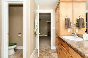 Bathroom with vanity and toilet