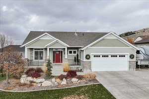 Craftsman-style house with a porch and a garage