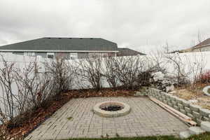 View of patio / terrace with a fire pit