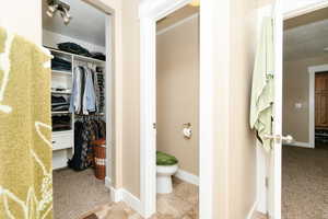 Bathroom with tile patterned flooring and toilet