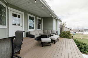 Wooden deck with an outdoor living space