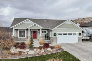 Craftsman inspired home featuring a garage