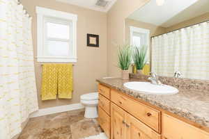 Bathroom with vanity and toilet