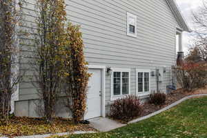 View of property exterior featuring a yard