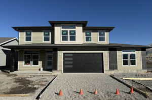 Prairie-style house featuring a garage