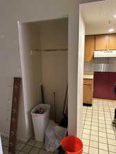 Washroom with light tile patterned floors