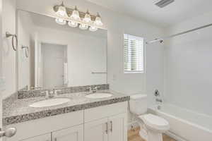 Full bathroom featuring shower / bathing tub combination, vanity, hardwood / wood-style flooring, and toilet