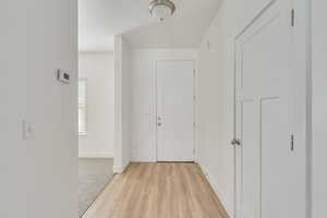 Corridor featuring light hardwood / wood-style floors