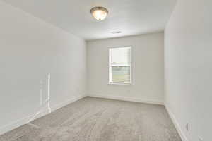 Empty room featuring carpet