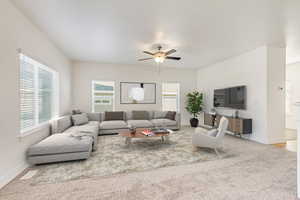 Living room with carpet floors and ceiling fan