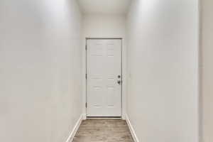 Entryway with light hardwood / wood-style flooring