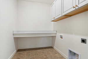 Laundry area featuring washer hookup, cabinets, and hookup for an electric dryer