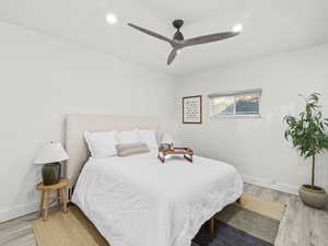 Bedroom featuring ceiling fan and light hardwood / wood-style floors