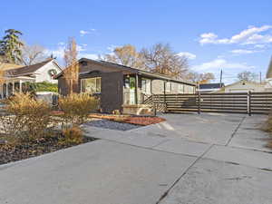 View of front facade featuring an outdoor structure and a garage