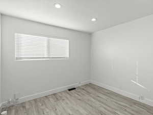 Empty room featuring light wood-type flooring