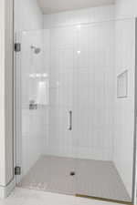 Full bathroom with a shower stall