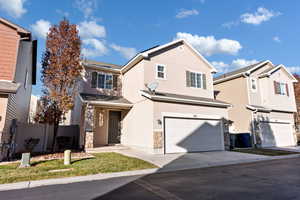 View of property featuring a garage