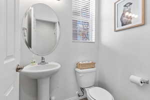 Bathroom featuring toilet and sink