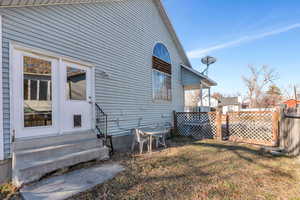 View of side of property featuring a yard