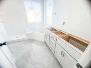 Bathroom featuring vanity and a bathtub